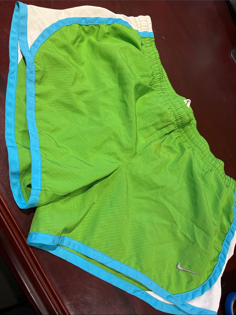 Nike Women's Lime Green Athletic Shorts with Blue Trim